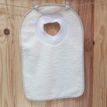 Babero para bebé cuello canalé liso plástificado